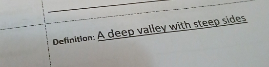 Definition: A deep valley with steep sides