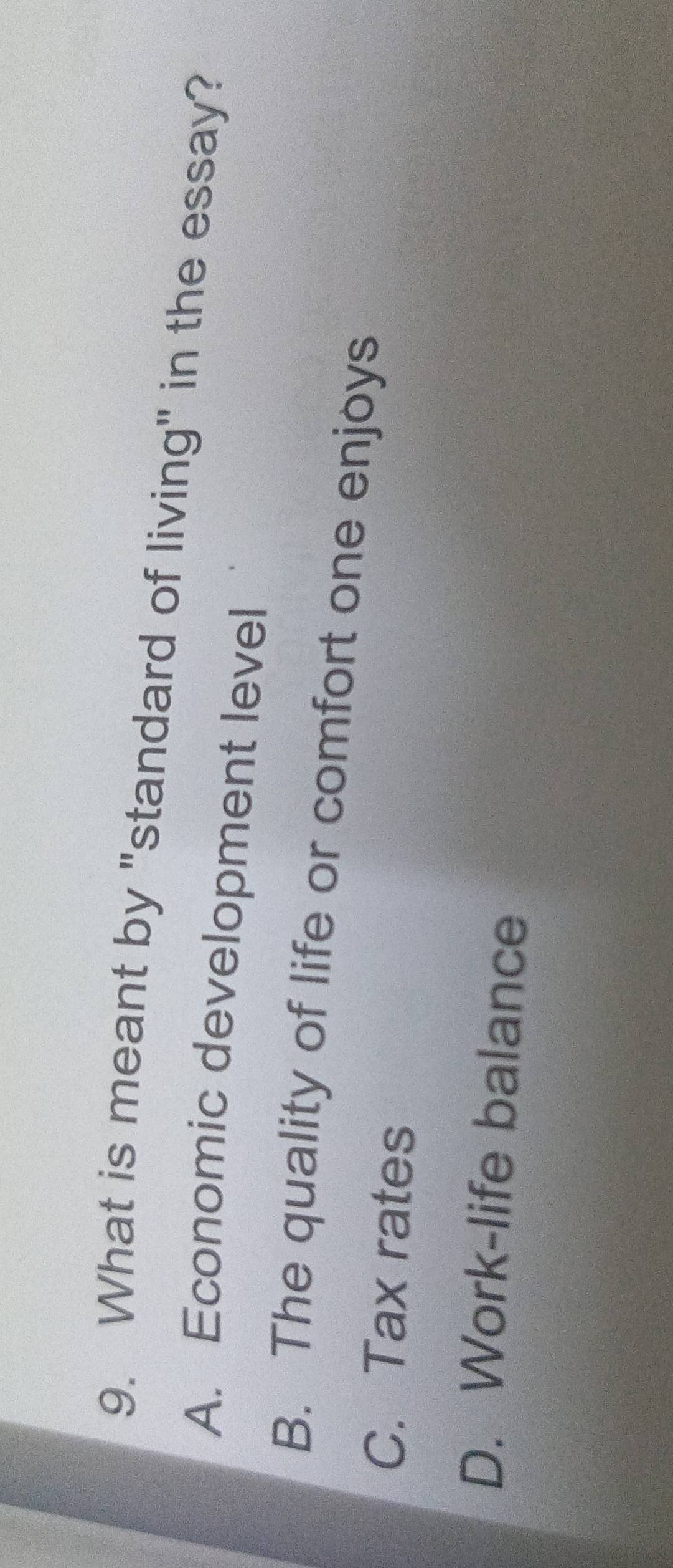What is meant by "standard of living" in the essay?
A. Economic development level
B. The quality of life or comfort one enjoys
C. Tax rates
D. Work-life balance