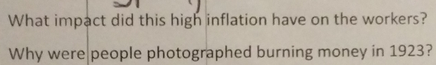 What impact did this high inflation have on the workers? 
Why were people photographed burning money in 1923?