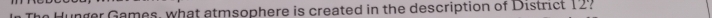 er Games, what atmsophere is created in the description of District 12?