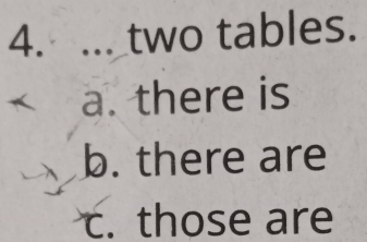 ... two tables. 
a. there is 
b. there are 
c. those are