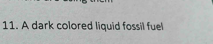 A dark colored liquid fossil fuel