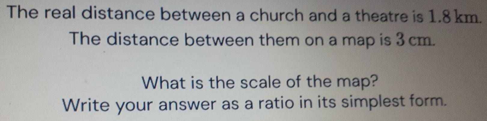 Solved: The real distance between a church and a theatre is 1.8 km. The ...