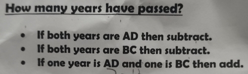 How many years have passed?
If both years are AD then subtract.
If both years are BC then subtract.
If one year is AD and one is BC then add.