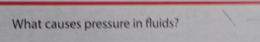 What causes pressure in fluids?