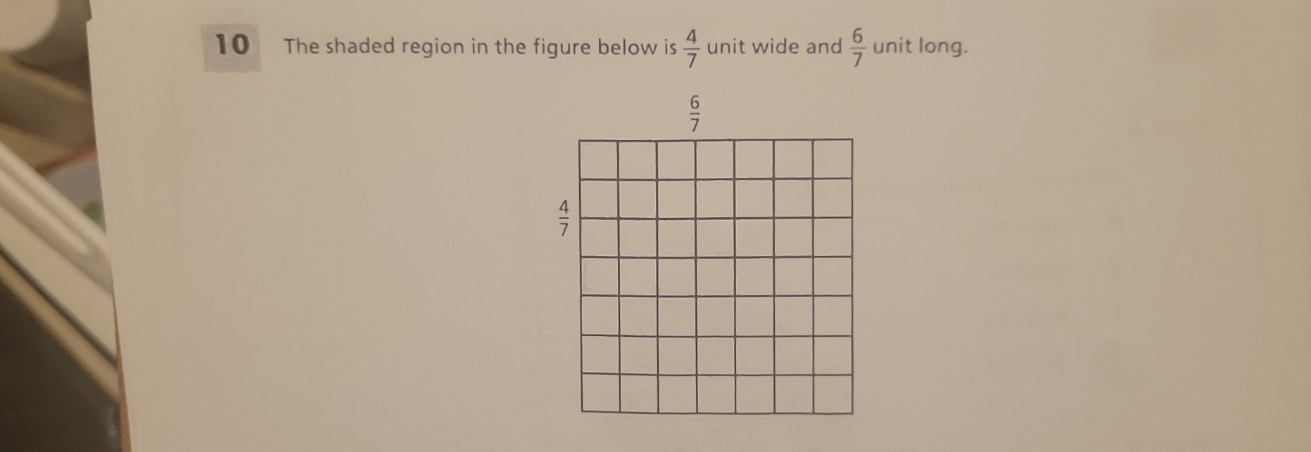 The shaded region in the figure below is  4/7  unit wide and  6/7  unit long.