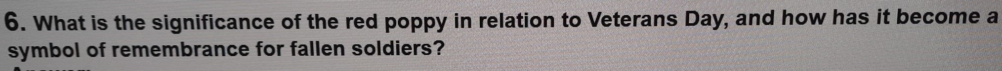 What is the significance of the red poppy in relation to Veterans Day, and how has it become a 
symbol of remembrance for fallen soldiers?