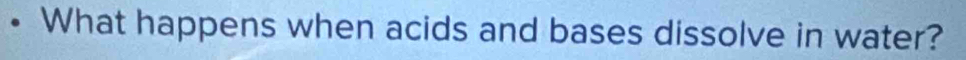 What happens when acids and bases dissolve in water?