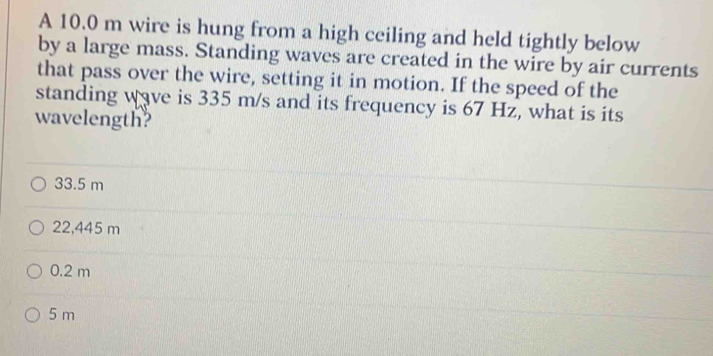 A 10.0 m wire is hung from a high ceiling and held tightly below by a ...