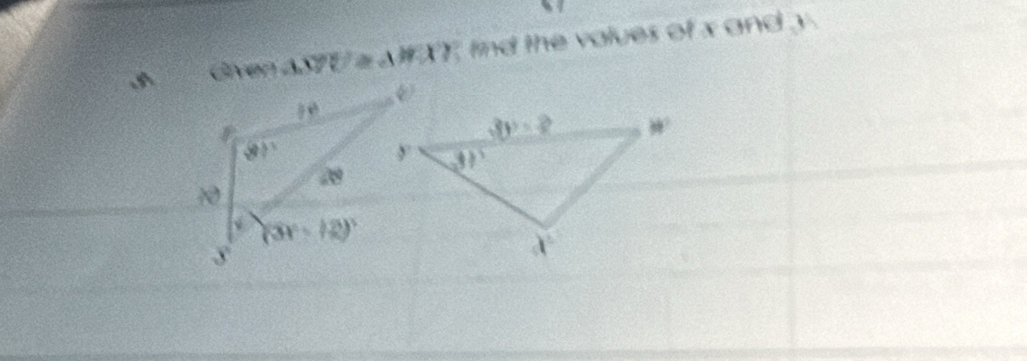 Given △ MUZ≌ △ HXY find the values of x and y .