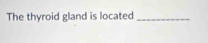 The thyroid gland is located_