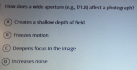 Solved: How does a wide aperture (e.g., f/1.8) affect a photograph ...