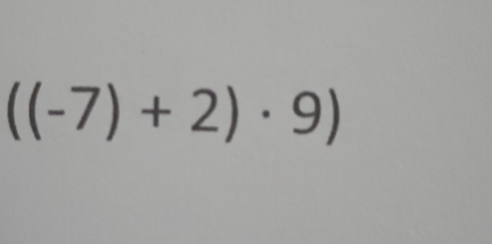 ((-7)+2)· 9)