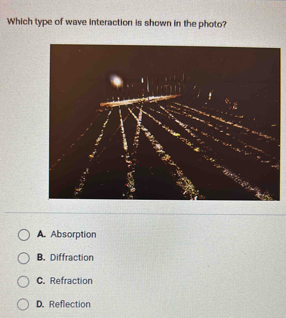 Which type of wave interaction is shown in the photo?
A. Absorption
B. Diffraction
C. Refraction
D. Reflection