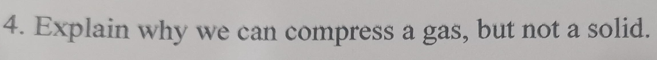 Explain why we can compress a gas, but not a solid.