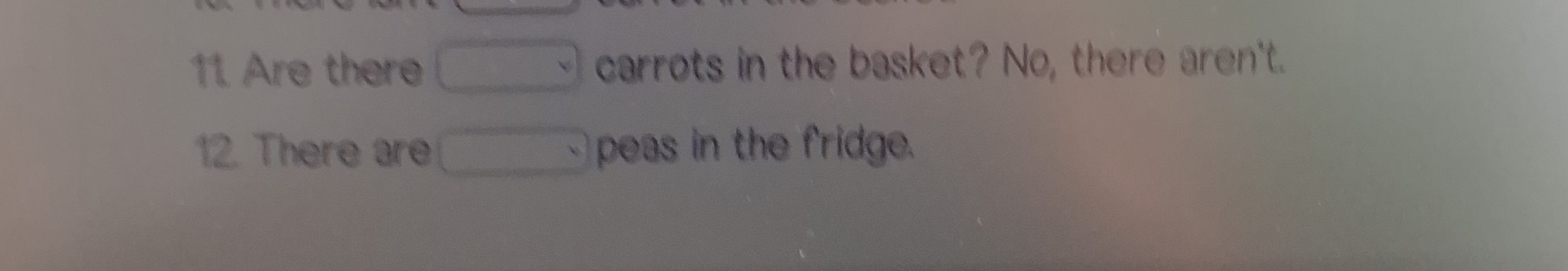 Are there carrots in the basket? No, there aren't. 
12. There are peas in the fridge.