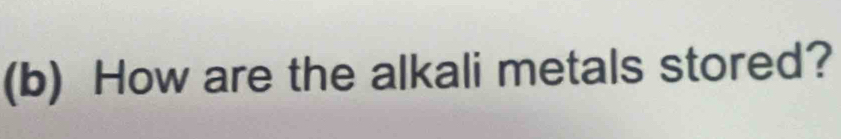 How are the alkali metals stored?