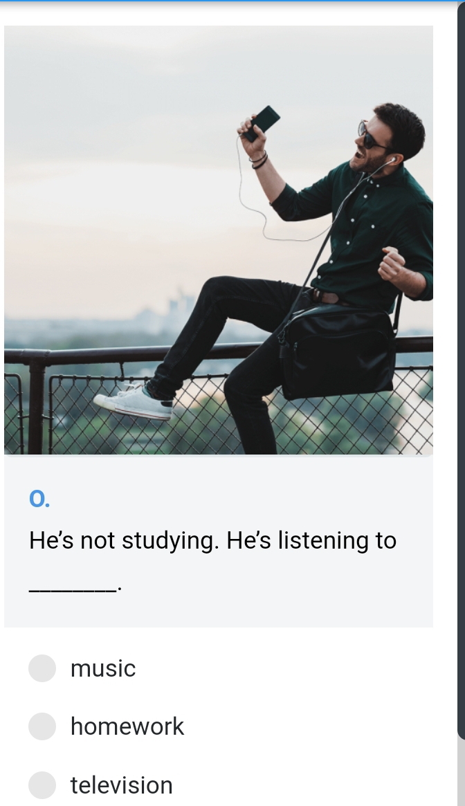 He's not studying. He's listening to
_·
music
homework
television