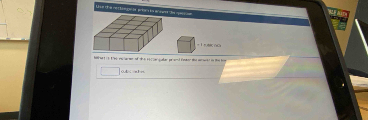 Use the rectangular prism to answer the question. 
BLE MAT 
What is the volume of the rectangular prism? Enter the answer in the box
cubic inches