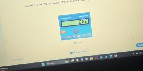 Round the number shown on the calcull 
tor 
0 7aum 
# Watch video 
くPrevious