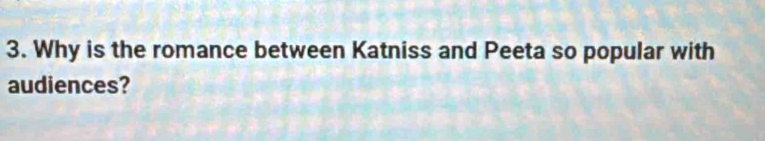 Why is the romance between Katniss and Peeta so popular with 
audiences?