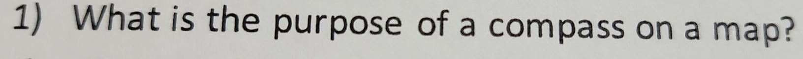 What is the purpose of a compass on a map?