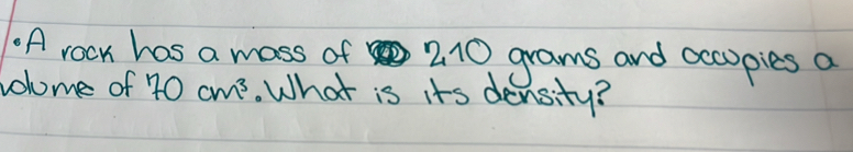 Solved: .A rocm has a mass of 210 grams and occopies a volome of 70cm^3 ...