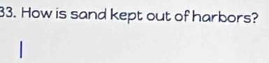 How is sand kept out of harbors?