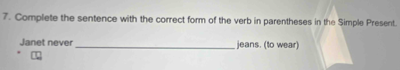 Complete the sentence with the correct form of the verb in parentheses in the Simple Present. 
Janet never _jeans. (to wear)