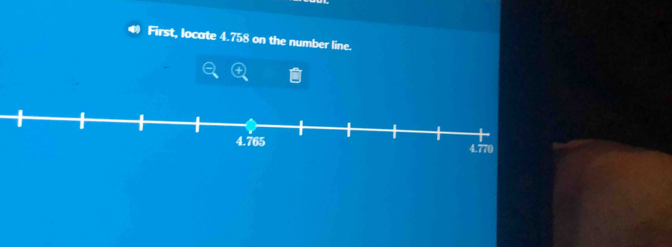 First, locate 4.758 on the number line.