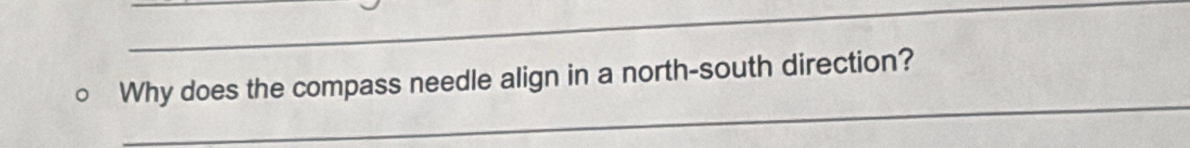 Why does the compass needle align in a north-south direction?