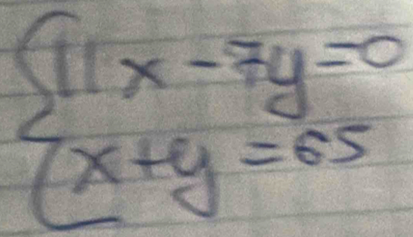 beginarrayl 11x-7y=0 x+y=65endarray.