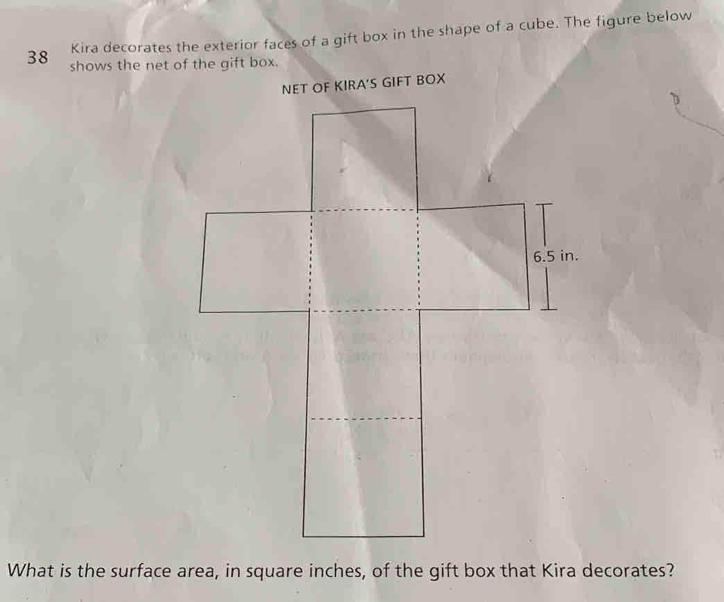 Kira decorates the exterior faces of a gift box in the shape of a cube. The figure below 
38 shows the net of the gift box. 
What is the surface area, in square inches, of the gift box that Kira decorates?