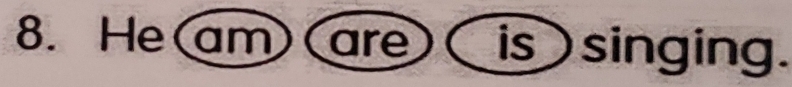 He(am)( are)( is singing.