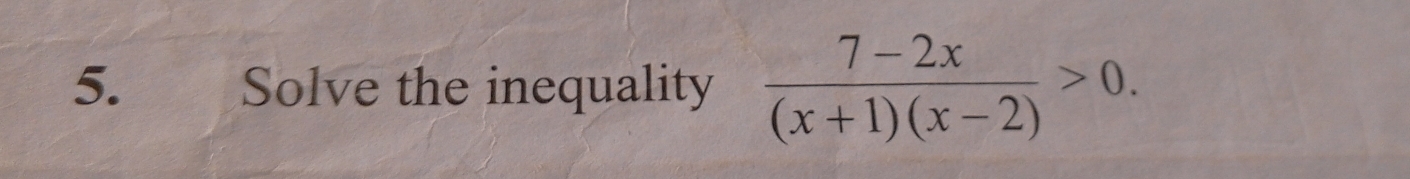 Solve the inequality  (7-2x)/(x+1)(x-2) >0.