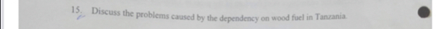Discuss the problems caused by the dependency on wood fuel in Tanzania.