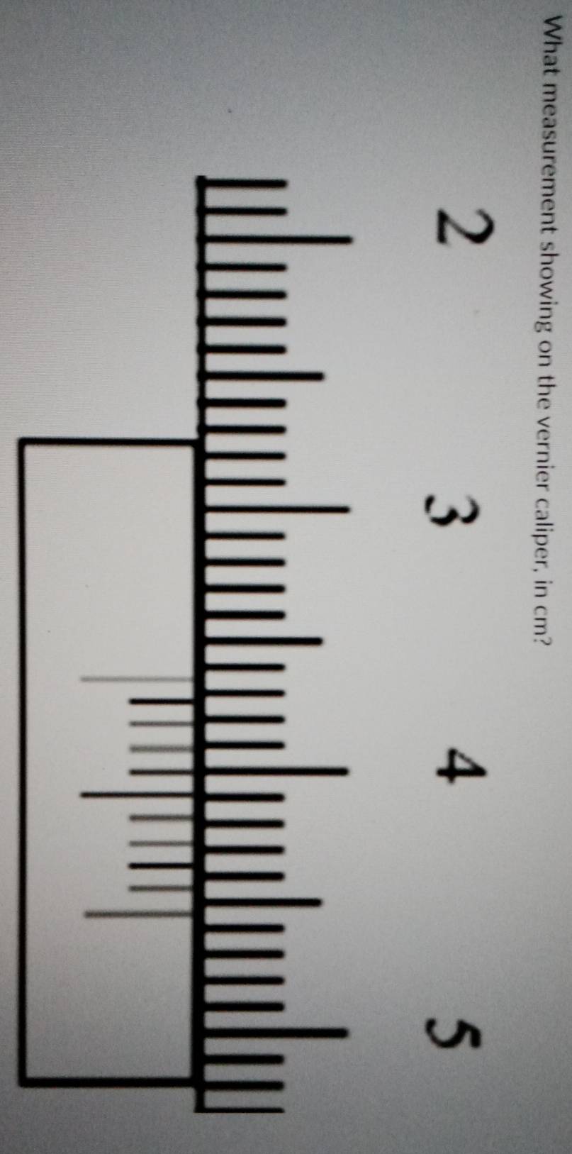 What measurement showing on the vernier caliper, in cm?