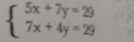 beginarrayl 5x+7y=29 7x+4y=29endarray.