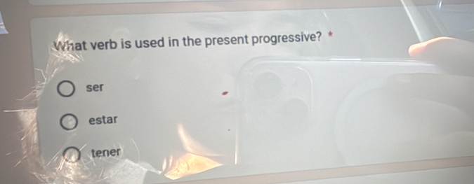 What verb is used in the present progressive?*
ser
estar
tener