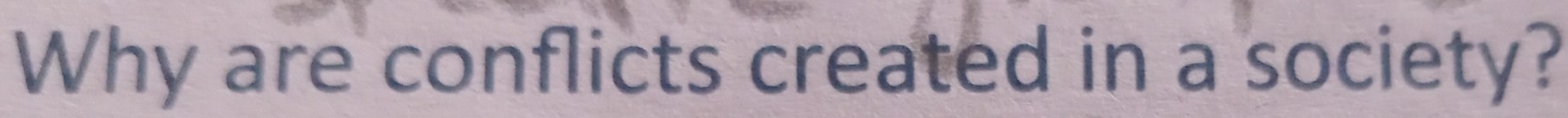 Why are conflicts created in a society?