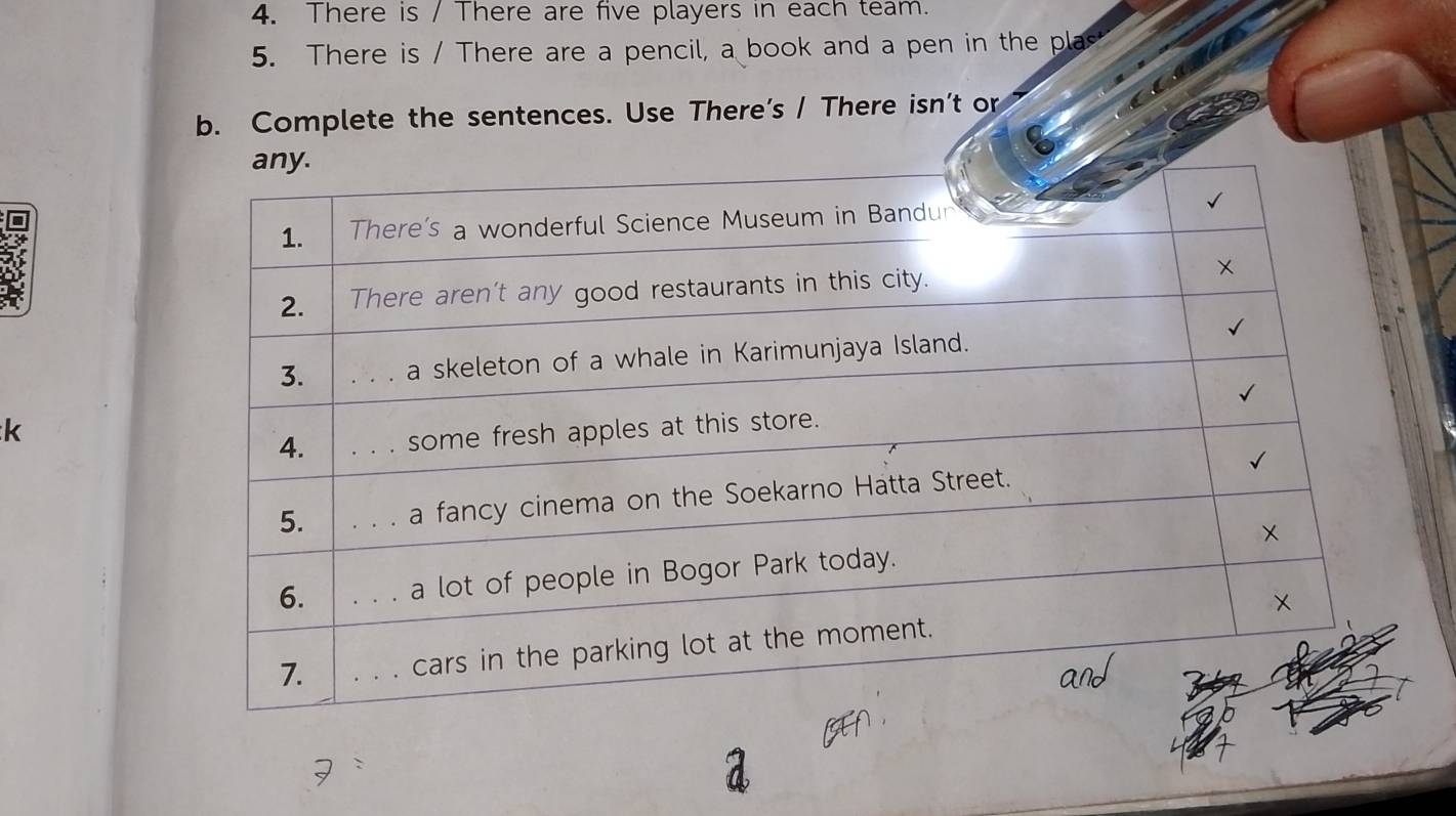 There is / There are five players in each team. 
5. There is / There are a pencil, a book and a pen in the plas 
b. Complete the sentences. Use There’s / There isn’t or 
k