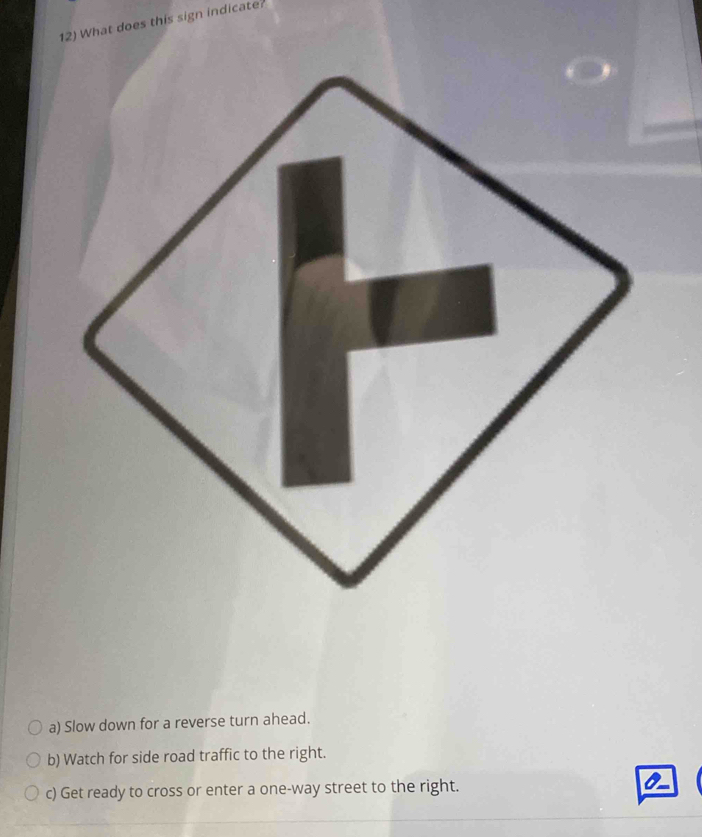 Solved: What does this sign indicate? a) Slow down for a reverse turn ...