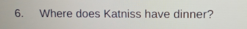 Where does Katniss have dinner?