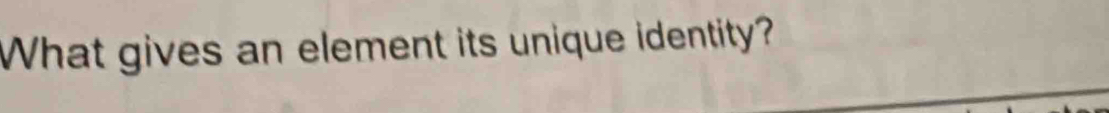 What gives an element its unique identity?