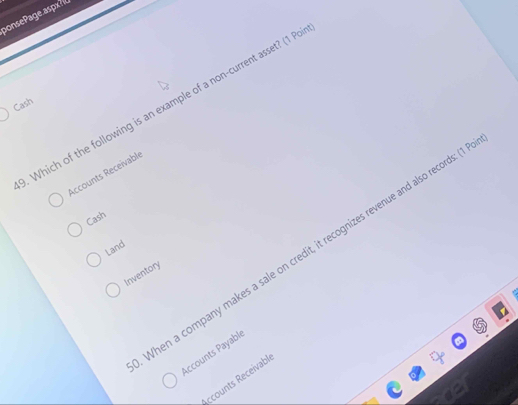 ponsePae asp 
Cash Which of the following is an example of a non-current asset? (1 P 
Accounts Receivable 
Cash 
hen a company makes a sale on credit, it recognizes revenue and also records: ( 
Land 
Inventory 
Accounts Payablé 
ccounts Receivabl