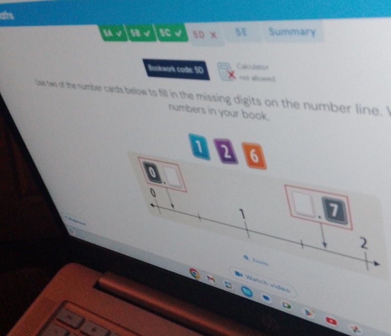 ds 
SA overline CY 58,surd 1° 1 50* 51 Summary 
Bookwork code: 5D Calculation 
not allowed 
Use two of the number cards below to fill in the missing digits on the number line. I 
numbers in your book.
2 6
0
0
1
7 
=Tgi== 
2 
Q Zoom 
* Watch viden