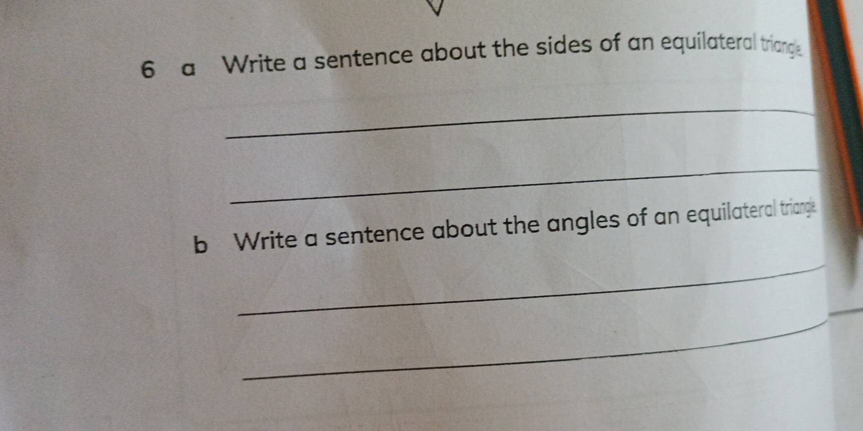 a Write a sentence about the sides of an equilateral triangle 
_ 
_ 
_ 
b Write a sentence about the angles of an equilateral triange. 
_