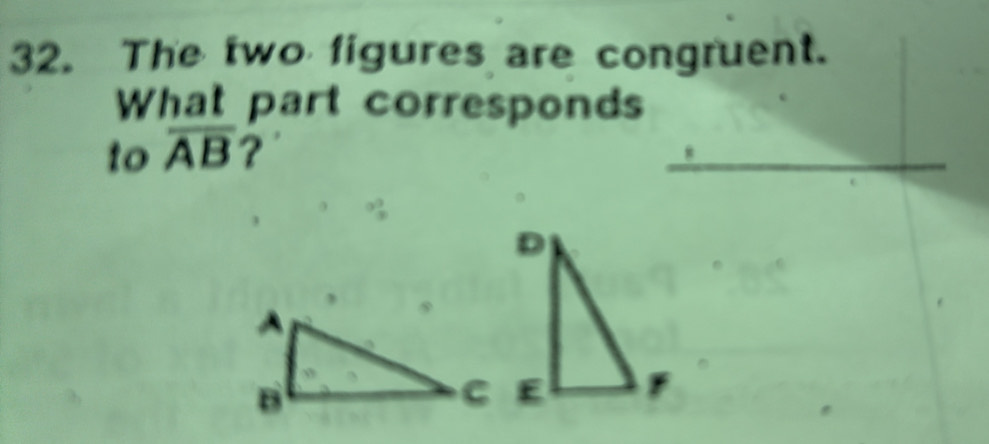 The two figures are congruent. 
What part corresponds 
to overline AB ?