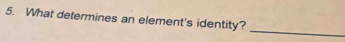 What determines an element's identity? 
_