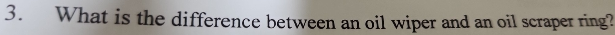 What is the difference between an oil wiper and an oil scraper ring?